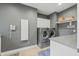 Laundry room features a washer, dryer, and built-in cabinets at 4023 Cedar Hills N Dr, Greenwood, IN 46143
