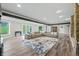 Finished basement with gray walls, stone fireplace and hardwood floors at 4023 Cedar Hills N Dr, Greenwood, IN 46143