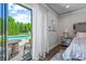 Bedroom with pool view, featuring a comfortable bed and sitting area at 4023 Cedar Hills N Dr, Greenwood, IN 46143