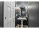 Elegant powder room with a pedestal sink and gold accents at 4023 Cedar Hills N Dr, Greenwood, IN 46143