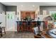 Basement bar with dark wood cabinets and black countertops at 4023 Cedar Hills N Dr, Greenwood, IN 46143