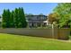 Brick wall encloses private backyard with lush landscaping at 4023 Cedar Hills N Dr, Greenwood, IN 46143