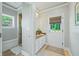 Bathroom with shower, granite countertop, and exterior access at 4023 Cedar Hills N Dr, Greenwood, IN 46143