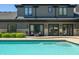 Inviting pool and patio area, featuring a home with French doors opening to the outdoors at 4023 Cedar Hills N Dr, Greenwood, IN 46143