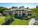 Luxury home with a modern design, large windows, and a landscaped yard at 4023 Cedar Hills N Dr, Greenwood, IN 46143