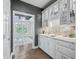 Butler's pantry with white cabinets and quartz countertops at 4023 Cedar Hills N Dr, Greenwood, IN 46143
