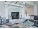 Living room fireplace with a modern stone facade and decorative mantle at 4023 Cedar Hills N Dr, Greenwood, IN 46143