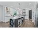 Modern kitchen with white cabinets, granite countertops, and stainless steel appliances at 4023 Cedar Hills N Dr, Greenwood, IN 46143