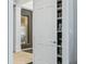 White door reveals a hidden bookshelf and a view of a water feature at 4023 Cedar Hills N Dr, Greenwood, IN 46143