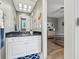 Bathroom with white vanity, black countertop, and view of bedroom at 4023 Cedar Hills N Dr, Greenwood, IN 46143