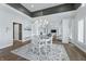Elegant dining room with a round table, chandelier, and view into the living room at 4023 Cedar Hills N Dr, Greenwood, IN 46143