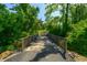 Scenic walking bridge leading through a tree-lined path at 4023 Cedar Hills N Dr, Greenwood, IN 46143