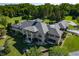 Luxury home with a large backyard, expansive lawn, and a stunning gray roof at 4023 Cedar Hills N Dr, Greenwood, IN 46143