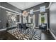 Elegant dining room with chandelier, hardwood floors, and large windows at 4023 Cedar Hills N Dr, Greenwood, IN 46143
