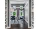 Formal dining room with built-in shelving and view of backyard at 4023 Cedar Hills N Dr, Greenwood, IN 46143