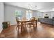 Bright dining area with wooden table and chairs, near living room at 917 Balto Dr, Shelbyville, IN 46176
