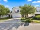 Two-story house with a white garage door and landscaped yard at 917 Balto Dr, Shelbyville, IN 46176