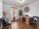Bright home office features a large desk, two chairs, and plenty of natural light at 917 Balto Dr, Shelbyville, IN 46176