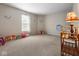 Bright bedroom featuring a large window and plenty of room for toys at 917 Balto Dr, Shelbyville, IN 46176