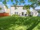 Large backyard with grassy area, patio, and fire pit at 917 Balto Dr, Shelbyville, IN 46176