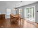 Charming dining room with a wooden table and four chairs, near sliding doors at 917 Balto Dr, Shelbyville, IN 46176