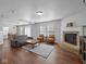 Spacious living room with a fireplace, comfy seating, and hardwood floors at 917 Balto Dr, Shelbyville, IN 46176