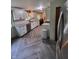 Modern kitchen with white shaker cabinets, granite countertops, and herringbone flooring at 1231 E 88Th St, Indianapolis, IN 46240
