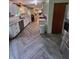 Modern kitchen with white shaker cabinets, granite countertops, and herringbone flooring at 1231 E 88Th St, Indianapolis, IN 46240