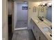 Modern bathroom with double vanity and walk-in shower at 1231 E 88Th St, Indianapolis, IN 46240