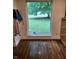 View from a window overlooking a grassy backyard and mature tree at 1231 E 88Th St, Indianapolis, IN 46240