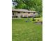Spacious backyard with deck, fire pit, and plenty of grass at 1231 E 88Th St, Indianapolis, IN 46240