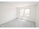 Simple bedroom with new carpet and large window at 2424 N Willow Way, Indianapolis, IN 46268
