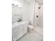 Bathroom with white vanity, marble shower, and toilet at 2424 N Willow Way, Indianapolis, IN 46268