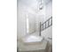 Modern entryway with stone-tiled steps and light hardwood floors at 2424 N Willow Way, Indianapolis, IN 46268