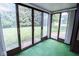 Sunroom with sliding glass doors leading to a view of the backyard at 2424 N Willow Way, Indianapolis, IN 46268