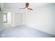 Well-lit bedroom featuring ceiling fan and closets at 2424 N Willow Way, Indianapolis, IN 46268