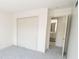 Bedroom with double doors leading to bathroom at 2424 N Willow Way, Indianapolis, IN 46268