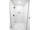Walk-in shower with marble tile and black fixtures at 2424 N Willow Way, Indianapolis, IN 46268