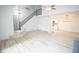 Open living room with hardwood floors and staircase at 2424 N Willow Way, Indianapolis, IN 46268