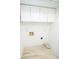 Laundry area with white cabinets and shelving at 2424 N Willow Way, Indianapolis, IN 46268