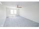 Bright bedroom featuring a ceiling fan and new carpet at 2424 N Willow Way, Indianapolis, IN 46268