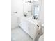 Double vanity bathroom with marble countertops and black matte fixtures at 2424 N Willow Way, Indianapolis, IN 46268