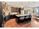 Modern kitchen with dark cabinetry and island at 1 Virginia Ave # 703, Indianapolis, IN 46204