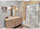Clean bathroom with single vanity and shower/tub combo at 1 Virginia Ave # 703, Indianapolis, IN 46204