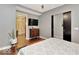 Bright bedroom with en-suite bathroom and TV at 1 Virginia Ave # 703, Indianapolis, IN 46204