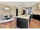 Kitchen features a dining area with hardwood floors and modern chandelier at 1 Virginia Ave # 703, Indianapolis, IN 46204