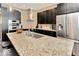 Gourmet kitchen boasts granite countertops and stainless steel appliances at 1 Virginia Ave # 703, Indianapolis, IN 46204