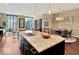 Granite kitchen island with sink and breakfast bar seating at 1 Virginia Ave # 703, Indianapolis, IN 46204