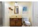 Basement bathroom with oak vanity, tile flooring, and a vintage vibe at 6835 Fox Lake S Dr, Indianapolis, IN 46278