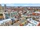 Aerial view of a city neighborhood with a mix of residential buildings and autumn foliage at 527 E North St, Indianapolis, IN 46204